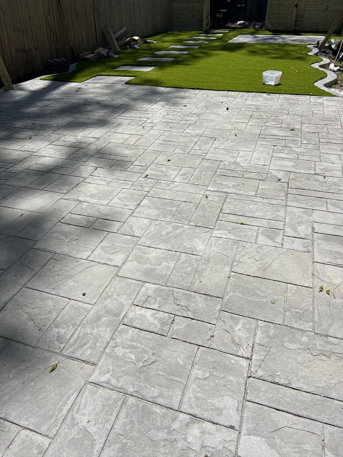 Stamped concrete patio with a slate-look ashlar pattern in Virginia Beach