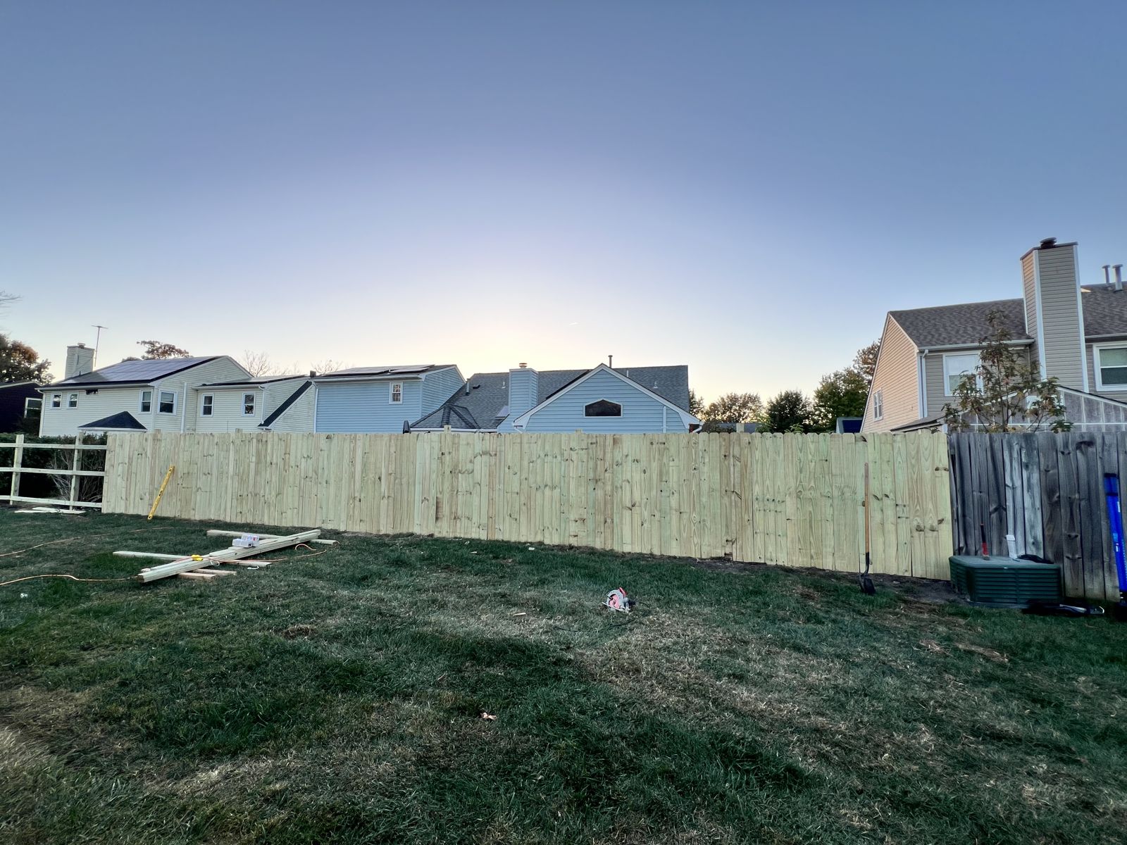 Long run of new wood privacy fencing in a Virginia Beach backyard